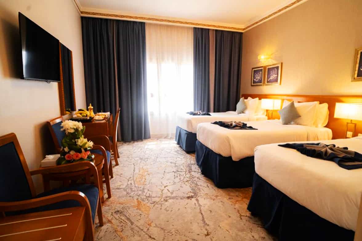 Posh Triple Queen Bedroom 